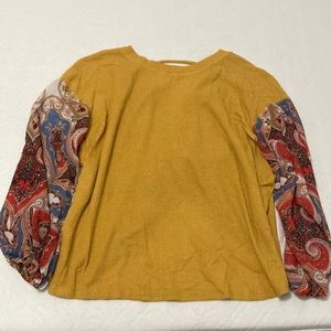 Mustard yellow puffy patterned long sleeved top